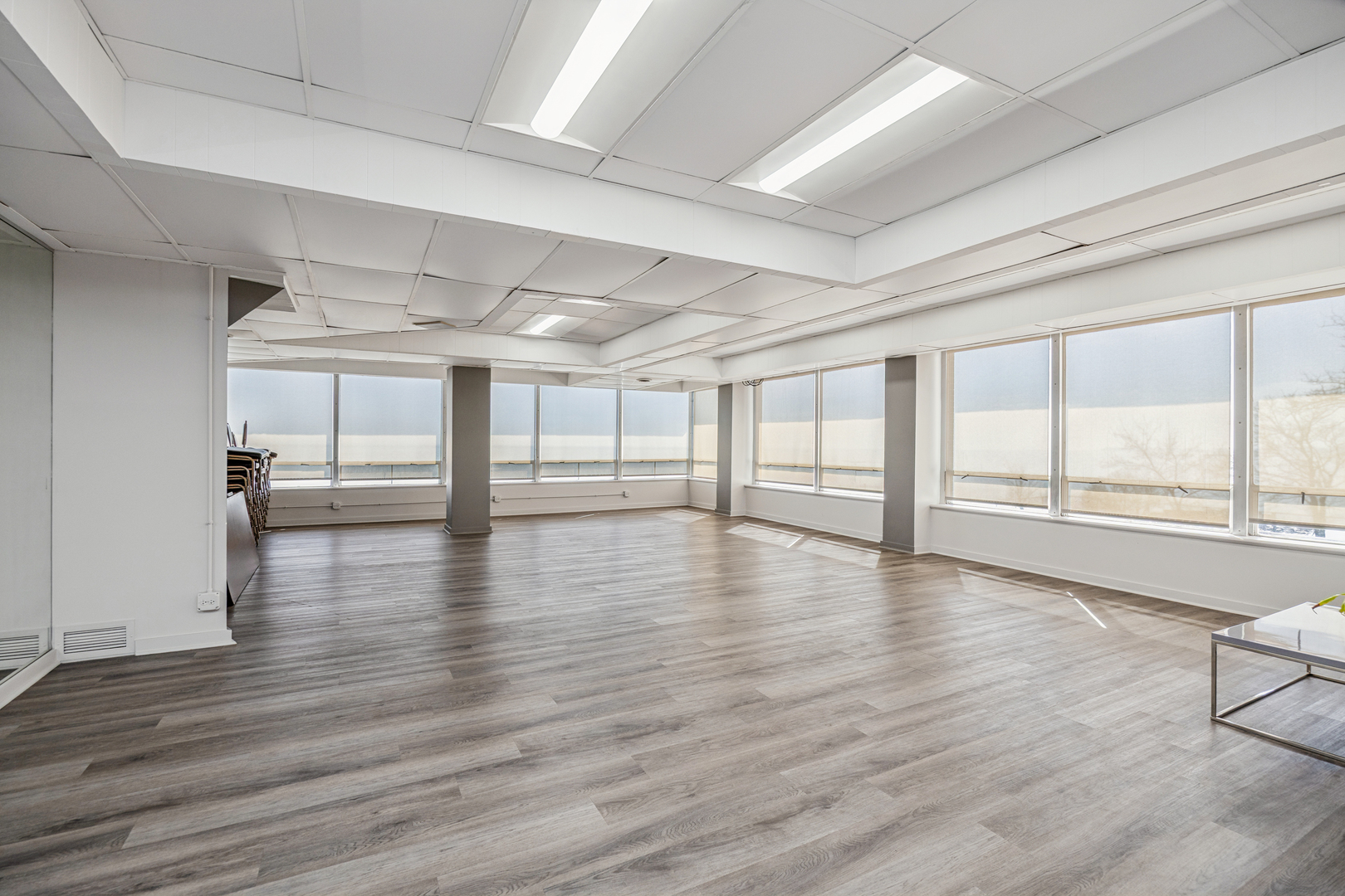 6301 North Sheridan Road, Unit 23J Chicago, IL 60660 - Photo 18 of 21 a view of an empty room with wooden floor and a window