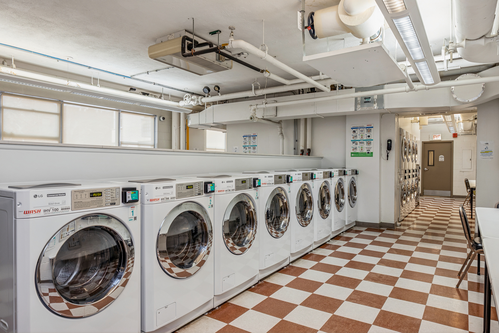 6301 North Sheridan Road, Unit 23J Chicago, IL 60660 - Photo 19 of 21 a view of a hallway with washer and dryer
