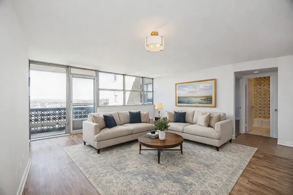 a living room with furniture and a large window