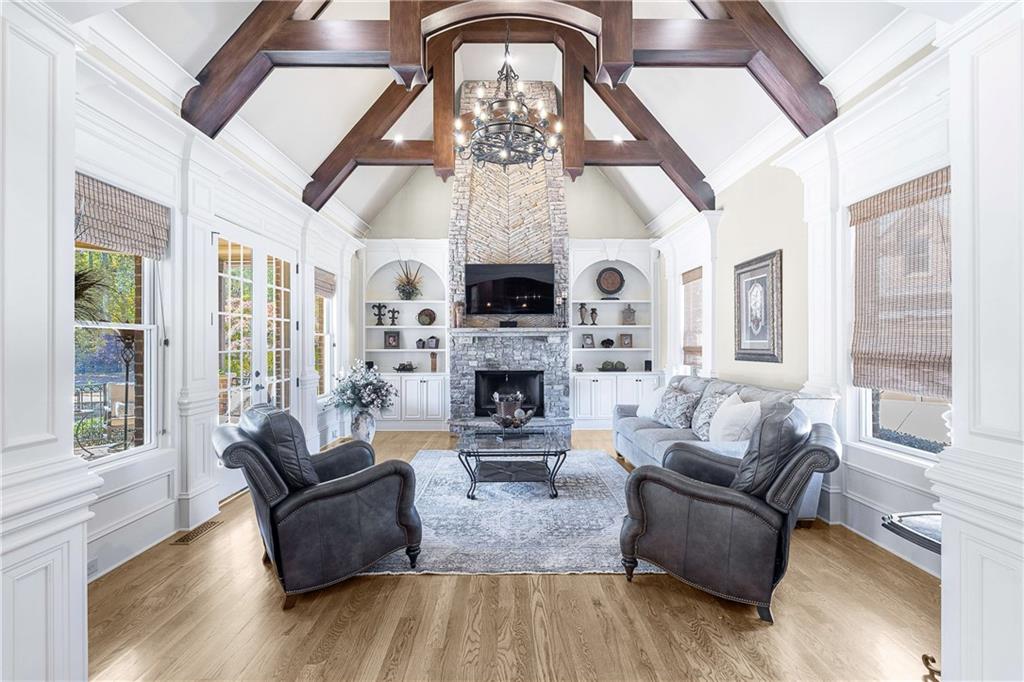 2145 Jones Phillips Road Dacula, GA 30019 - Photo 13 of 98 a living room with furniture a fireplace and a large window