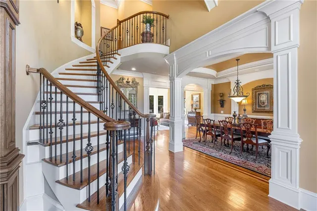 a living room with furniture a fireplace and a large window