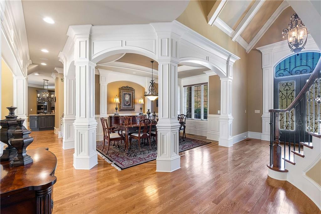 2145 Jones Phillips Road Dacula, GA 30019 - Photo 23 of 98 a living room with fireplace furniture and a chandelier