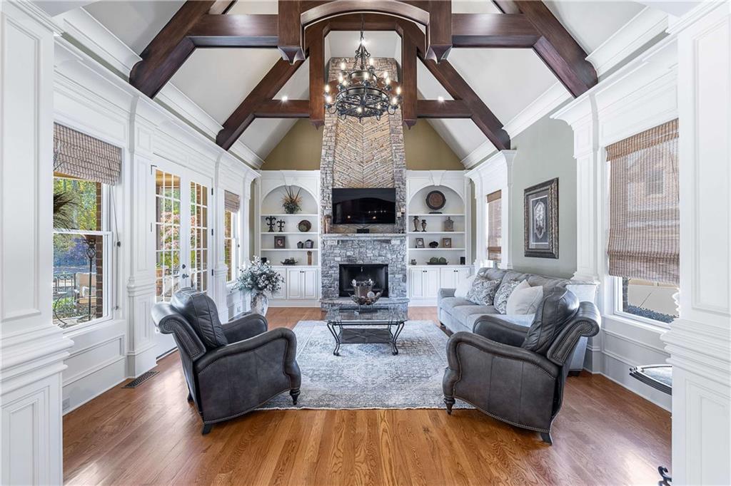 2145 Jones Phillips Road Dacula, GA 30019 - Photo 39 of 98 a living room with furniture a fireplace and a large window