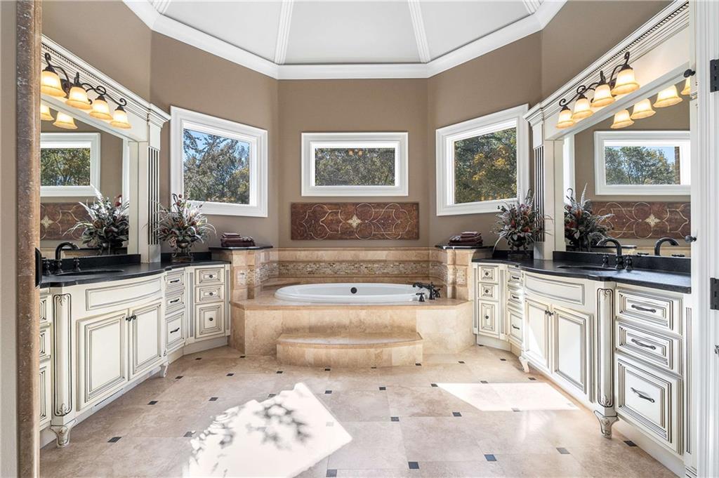 2145 Jones Phillips Road Dacula, GA 30019 - Photo 46 of 98 a large white kitchen with a large window