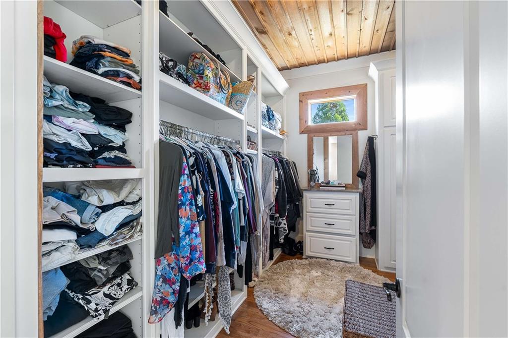 2145 Jones Phillips Road Dacula, GA 30019 - Photo 49 of 98 a view of walk in closet with clothes and shoes