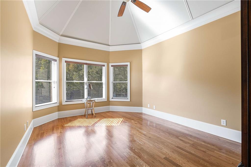 2145 Jones Phillips Road Dacula, GA 30019 - Photo 59 of 98 a view of an empty room with wooden floor and a window