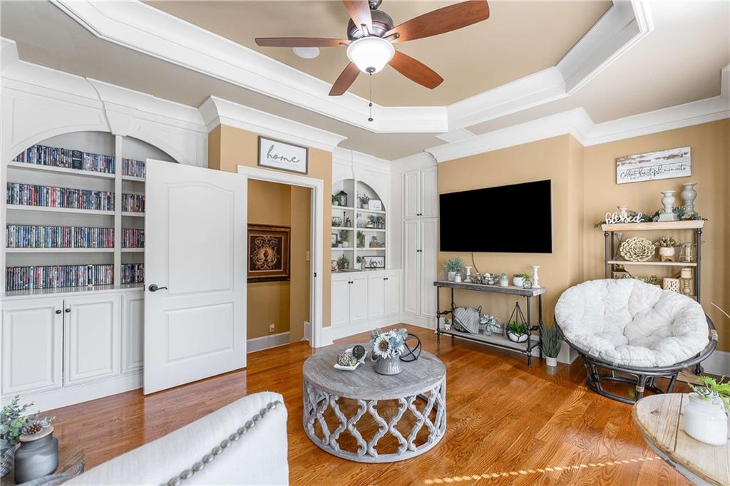 2145 Jones Phillips Road Dacula, GA 30019 - Photo 63 of 98 a living room with furniture and a flat screen tv