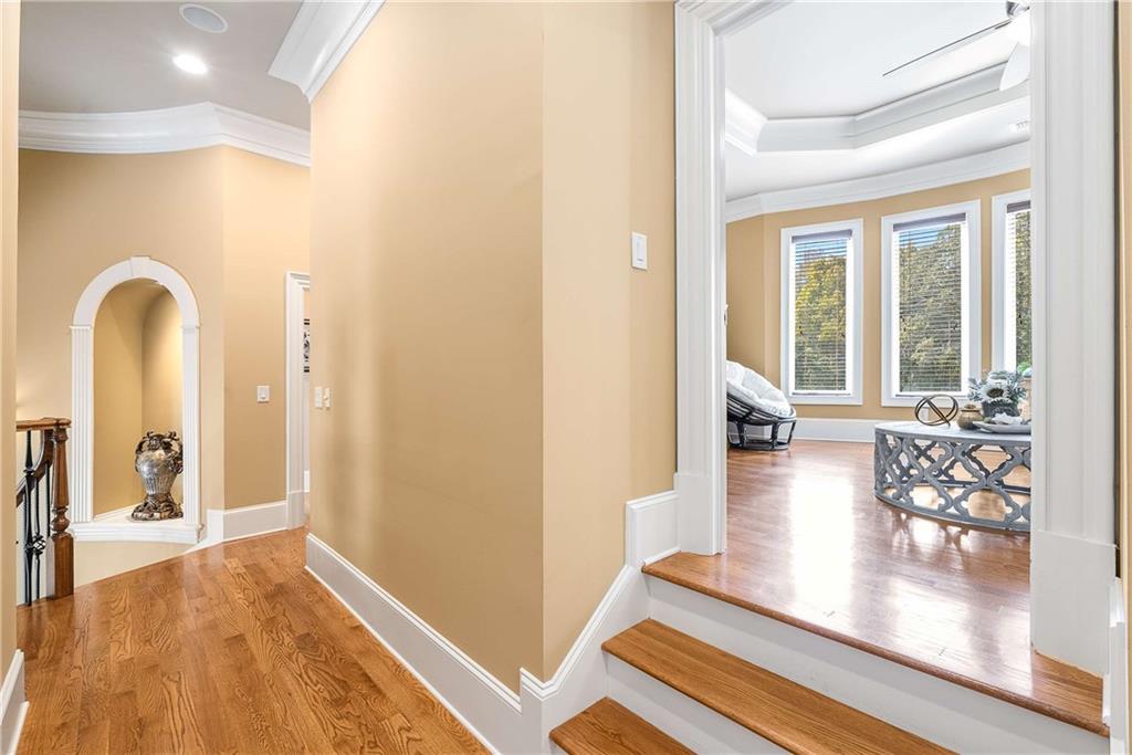 2145 Jones Phillips Road Dacula, GA 30019 - Photo 64 of 98 a view of a hallway with wooden floor and a living room