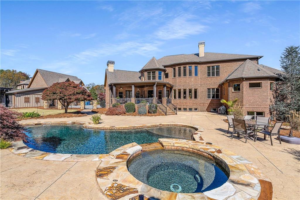 2145 Jones Phillips Road Dacula, GA 30019 - Photo 74 of 98 a view of a swimming pool with an outdoor space