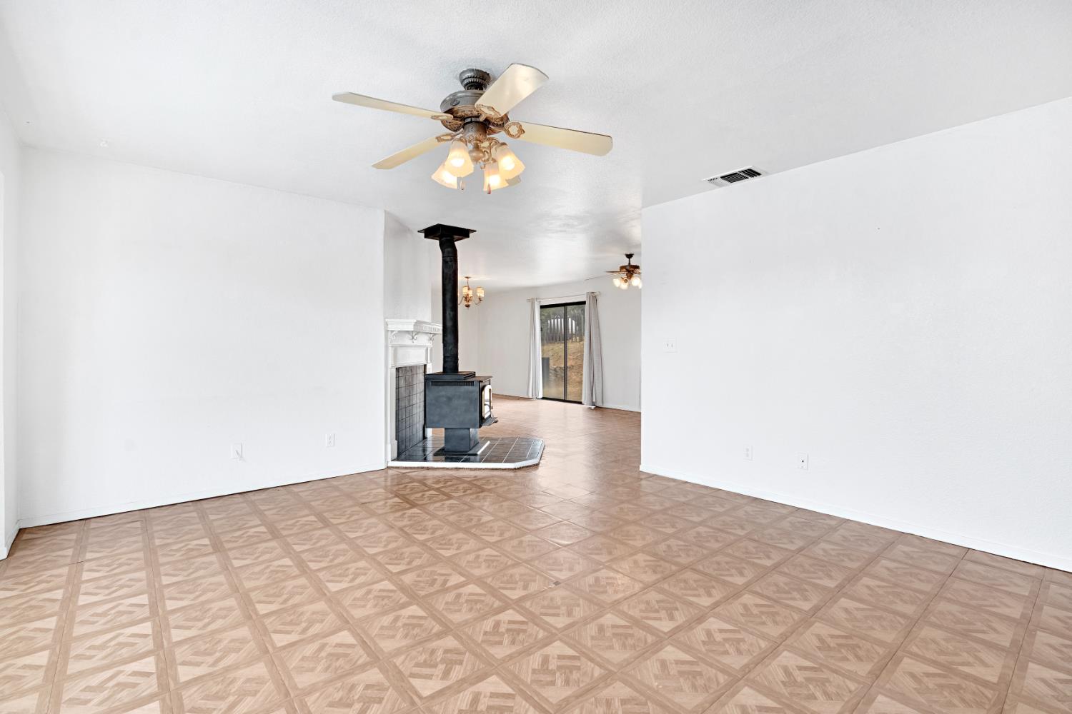 29668 Seminole Road Tollhouse, CA 93667 - Photo 26 of 28 a view of an empty room with a chandelier fan
