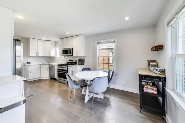 a view of kitchen with cabinets and wooden floor