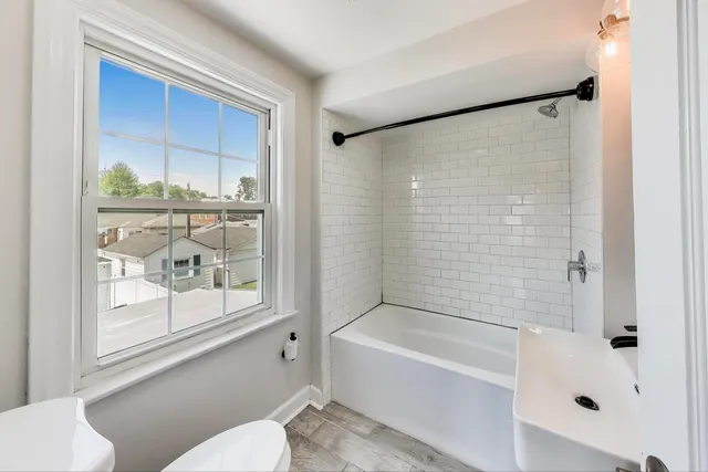 a bathroom with a bathtub and a shower