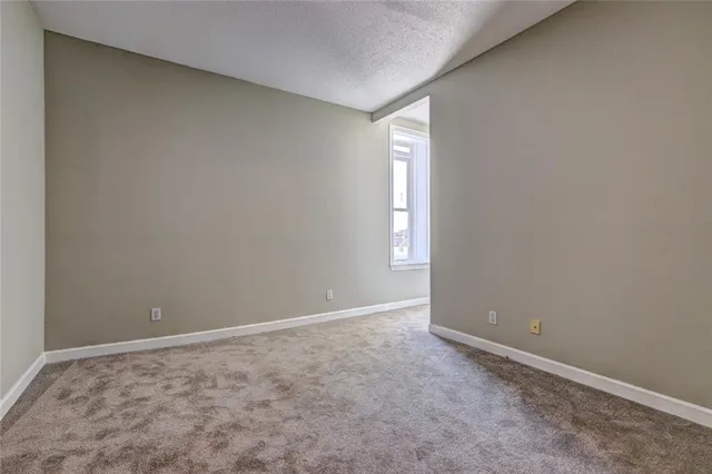 a view of an empty room and window