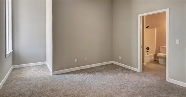 an empty room and a toilet