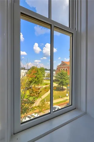 a view of a room with a large window