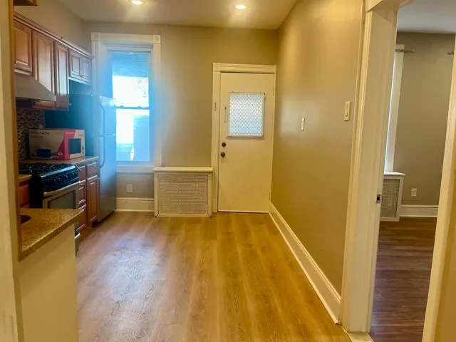 a view of a room with wooden floor and stairs