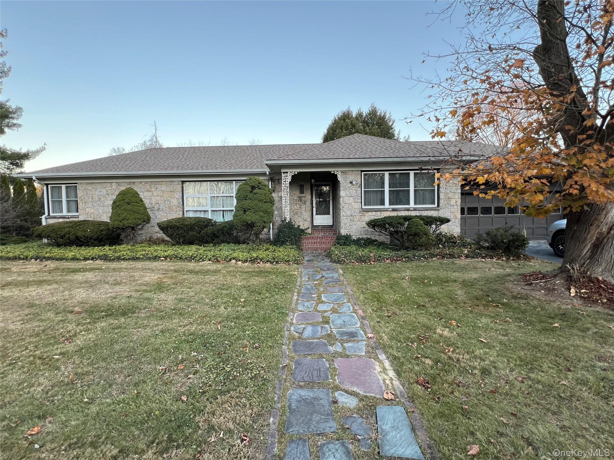 10 Memory Lane Poughkeepsie, NY 12603 - Photo 1 of 1 a front view of a house with garden