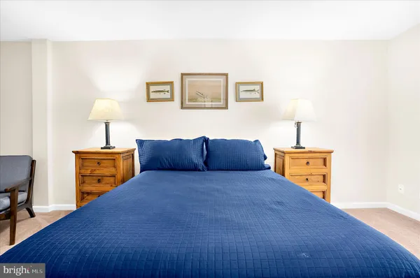 a bedroom with a bed and a chair