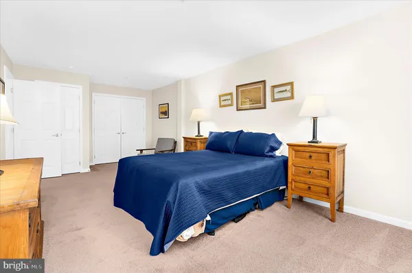a bedroom with a bed and dresser