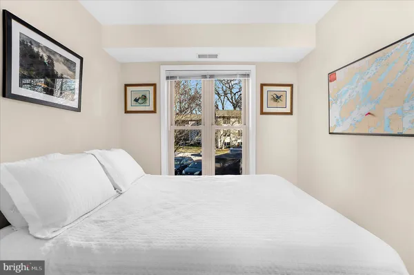 a large white bed in a white room
