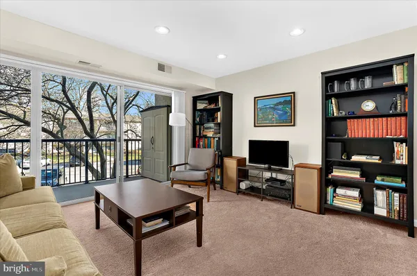 a living room with furniture kitchen and a kitchen view