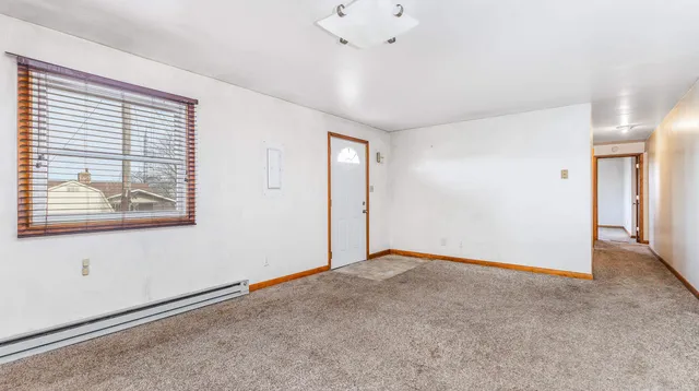 a view of an empty room with a window