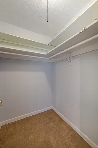 a view of a room with racks on the wall