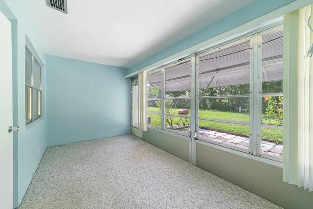 a view of an empty room with a large window