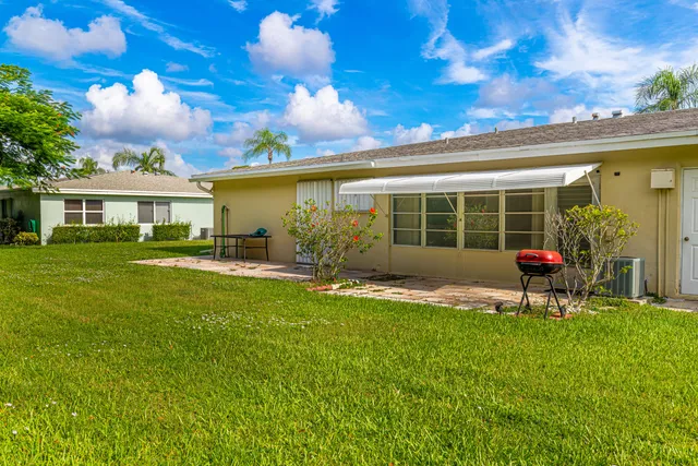 a table and chairs in front of a house
