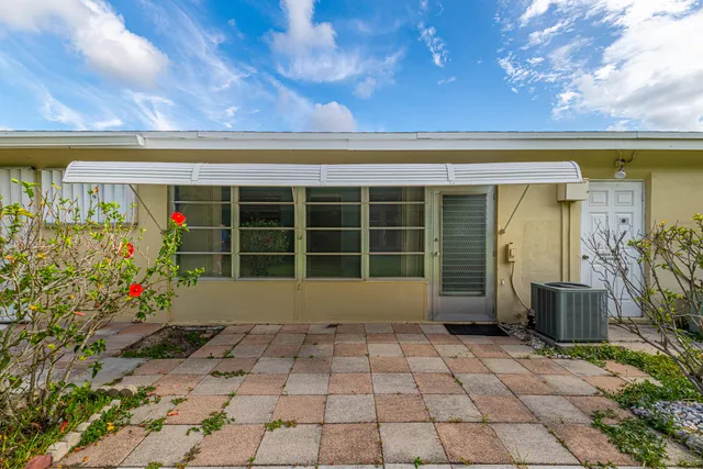 a view of a hall with paintings on the wall