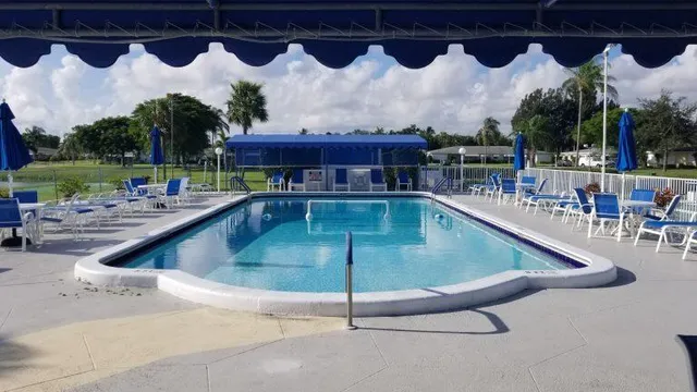 a view of a porch with furniture and a yard