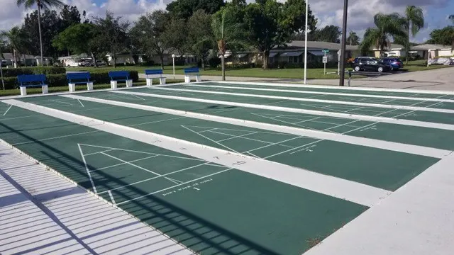 an aerial view of a house with a yard basket ball court and outdoor seating