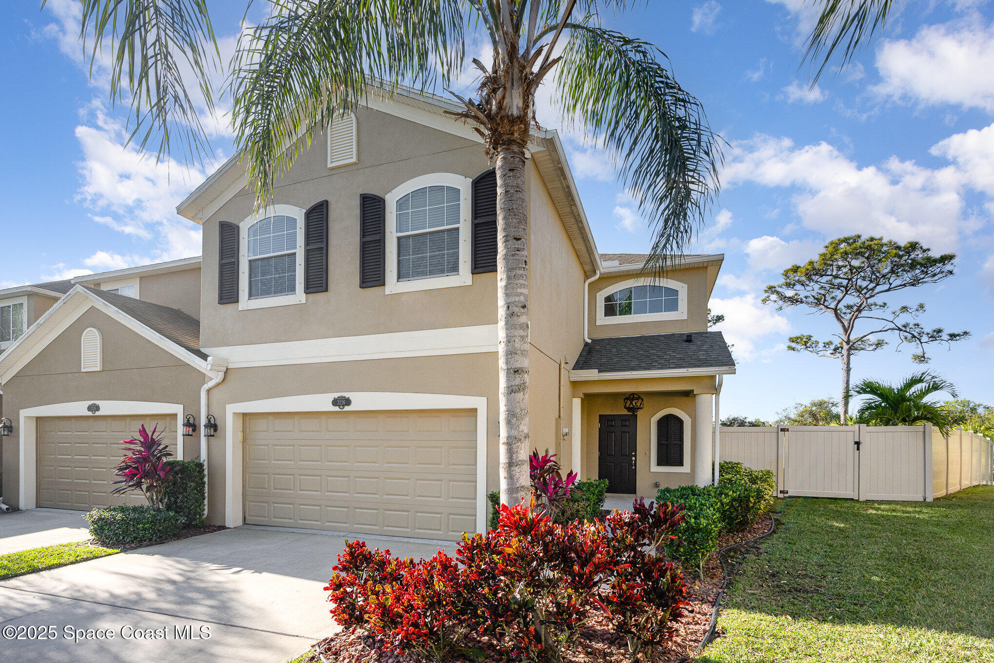 3226 Arden Circle Melbourne, FL 32934 - Photo 2 of 43 a front view of a house with a garden