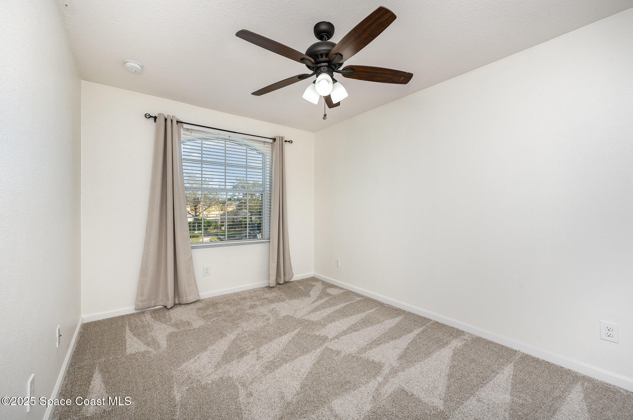 3226 Arden Circle Melbourne, FL 32934 - Photo 28 of 43 a view of an empty room with a window