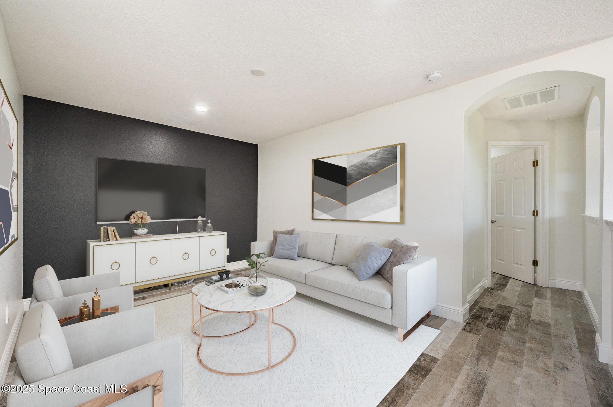 3226 Arden Circle Melbourne, FL 32934 - Photo 31 of 43 a living room with furniture and a flat screen tv