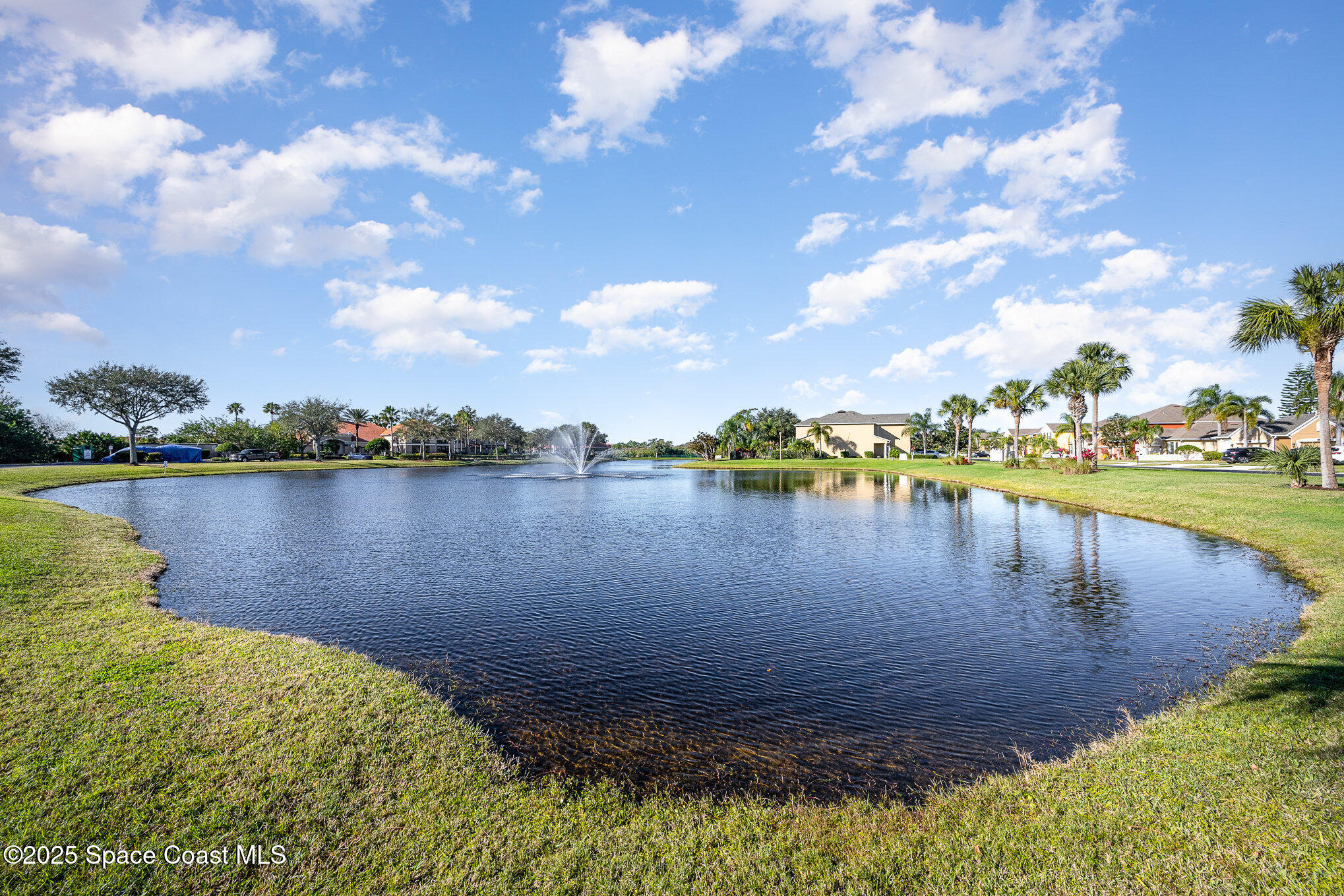 3226 Arden Circle Melbourne, FL 32934 - Photo 39 of 43 a view of a lake with houses