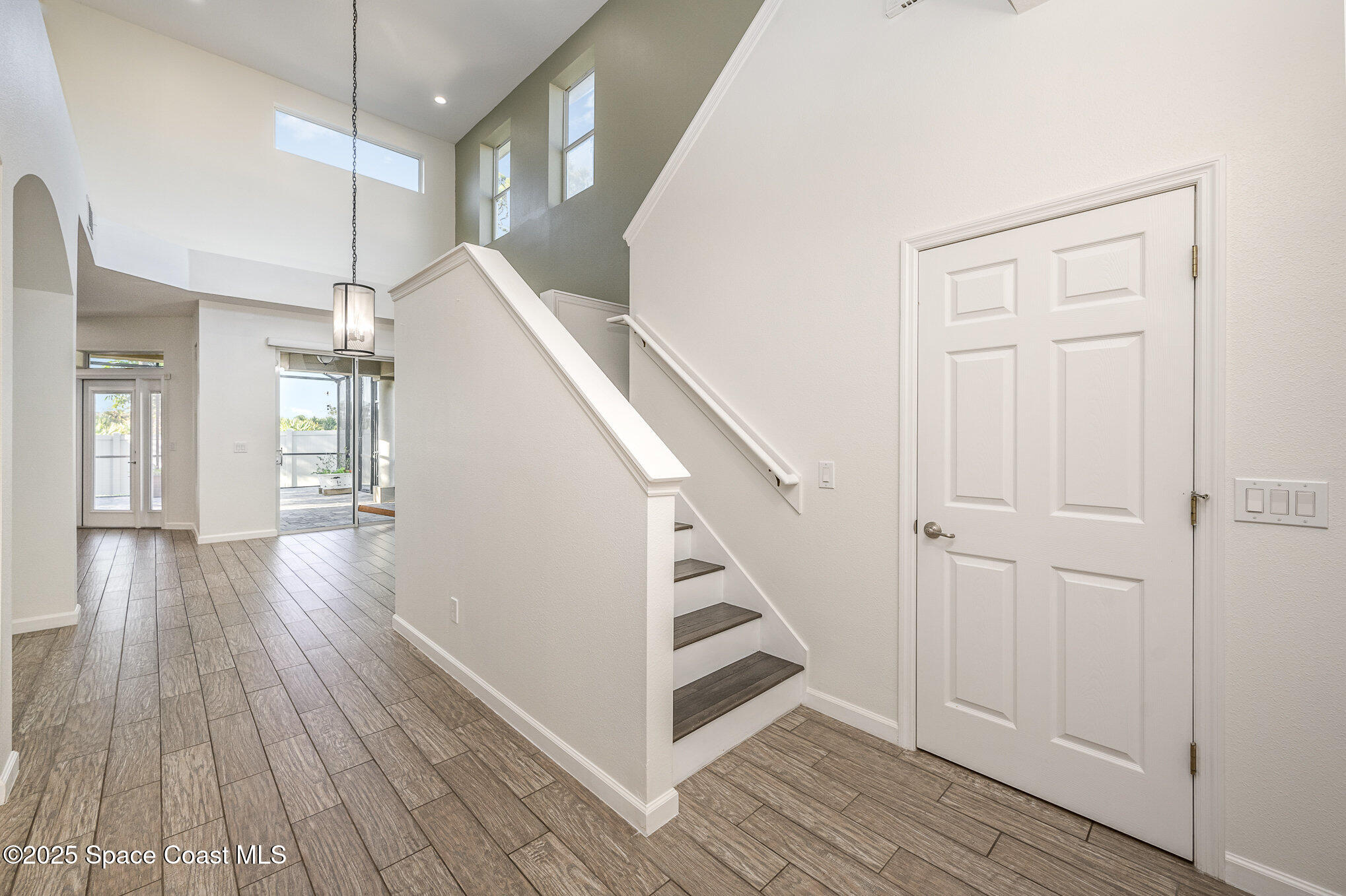 3226 Arden Circle Melbourne, FL 32934 - Photo 4 of 43 a view of entryway and hall with wooden floor