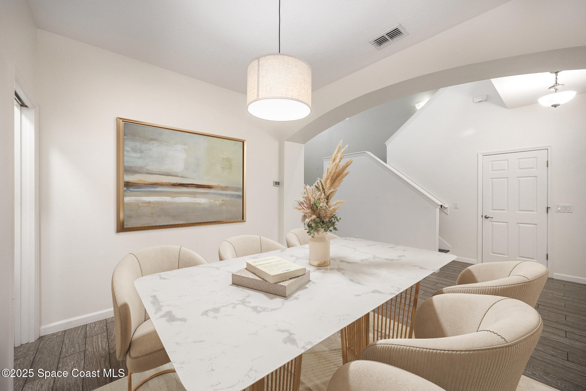 3226 Arden Circle Melbourne, FL 32934 - Photo 5 of 43 a view of a dining room with furniture and wooden floor