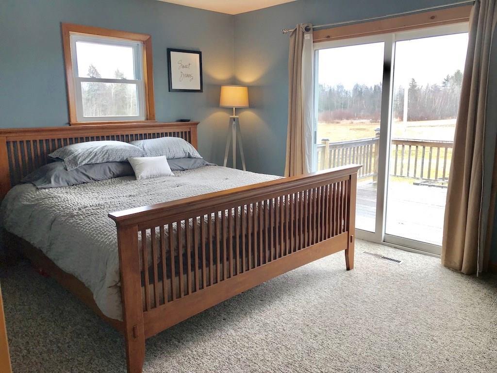 239 Gordon Hill Road Thorndike, ME 04986 - Photo 9 of 20 Master with sliding doors to the deck!