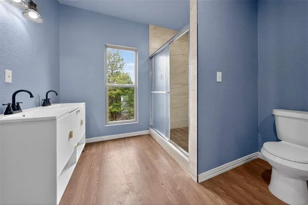a bathroom with a toilet sink and tub