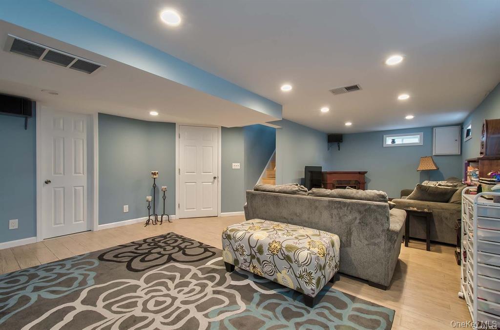 15 Janet Drive Plainview, NY 11803 - Photo 13 of 23 a living room with a couch and a coffee table