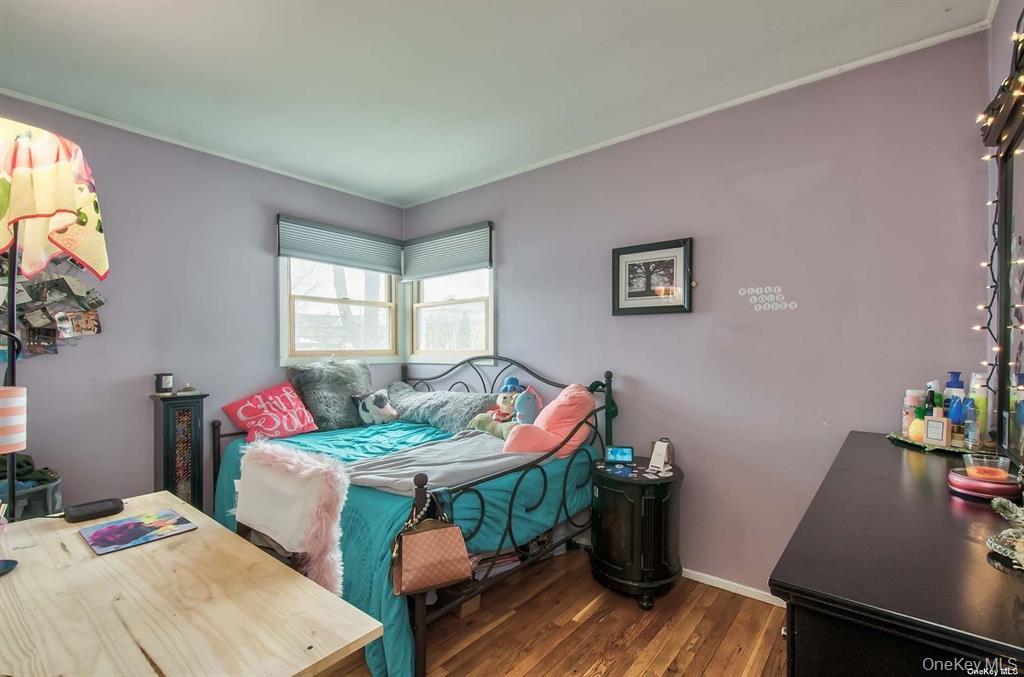 15 Janet Drive Plainview, NY 11803 - Photo 17 of 23 a living room with furniture and a wooden floor