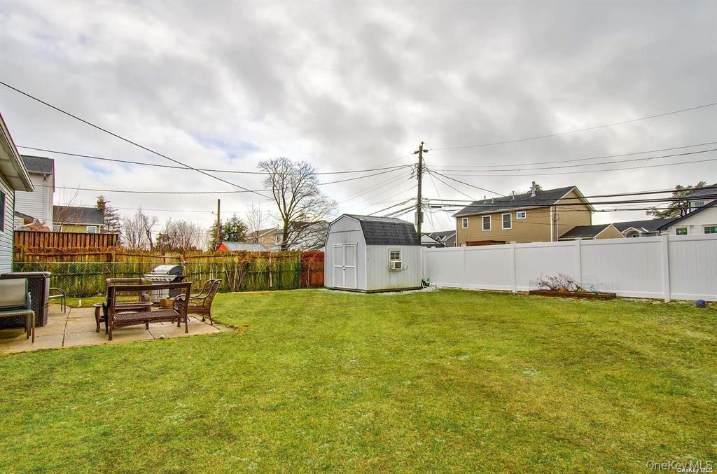 15 Janet Drive Plainview, NY 11803 - Photo 22 of 23 a view of a garden with a bench