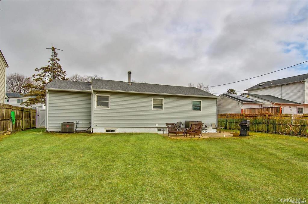 15 Janet Drive Plainview, NY 11803 - Photo 23 of 23 a backyard of a house with yard and outdoor seating
