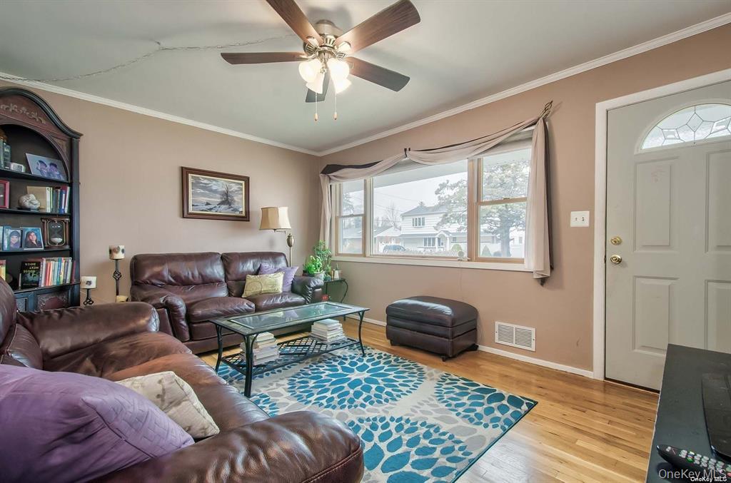 15 Janet Drive Plainview, NY 11803 - Photo 9 of 23 a living room with furniture and a window
