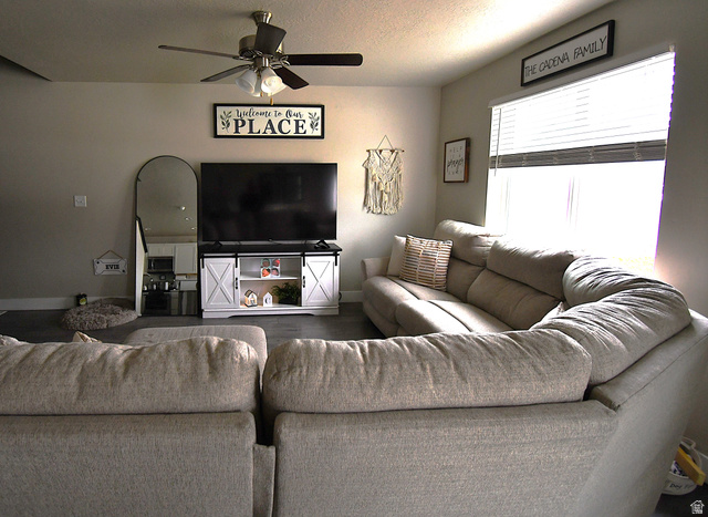 1688 West 200 North Mapleton, UT 84664 - Photo 2 of 18 Living room with a ceiling fan and a textured ceiling