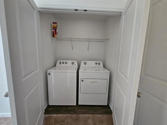 a utility room with dryer and washer