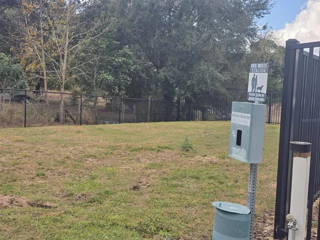 a view of a park with swings and slides