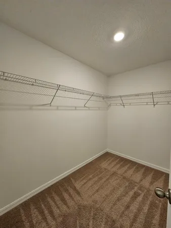 a view of a room with racks on the wall