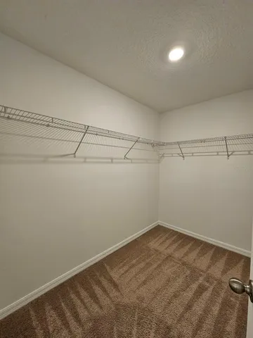 a view of a room with racks on the wall